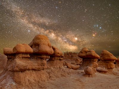 Milky Way and starry sky over red rock hoodoos at Goblin Valley State Park