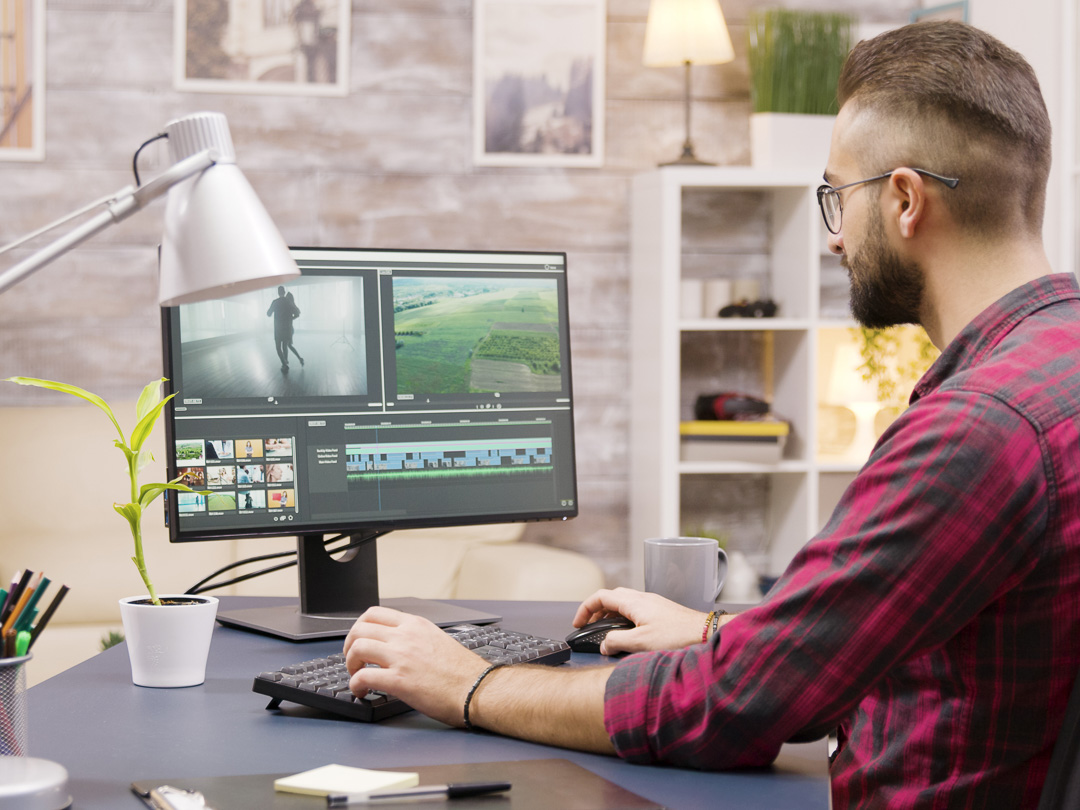 Creative filmmaker working on post production of a movie