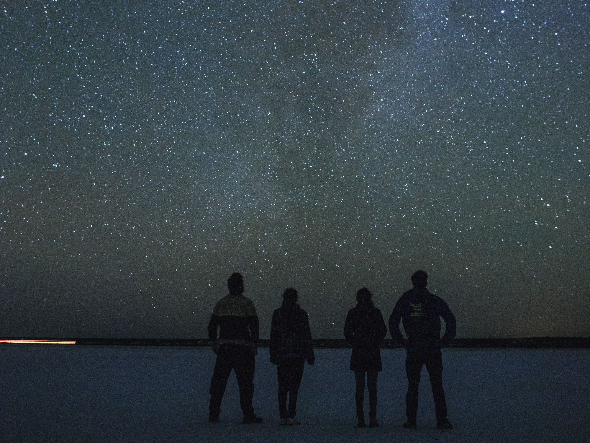 People standing under the stars